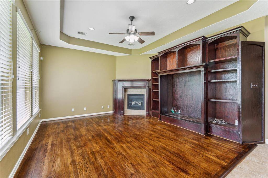 family Living with custom built in cupboard same in Primary Bead room also