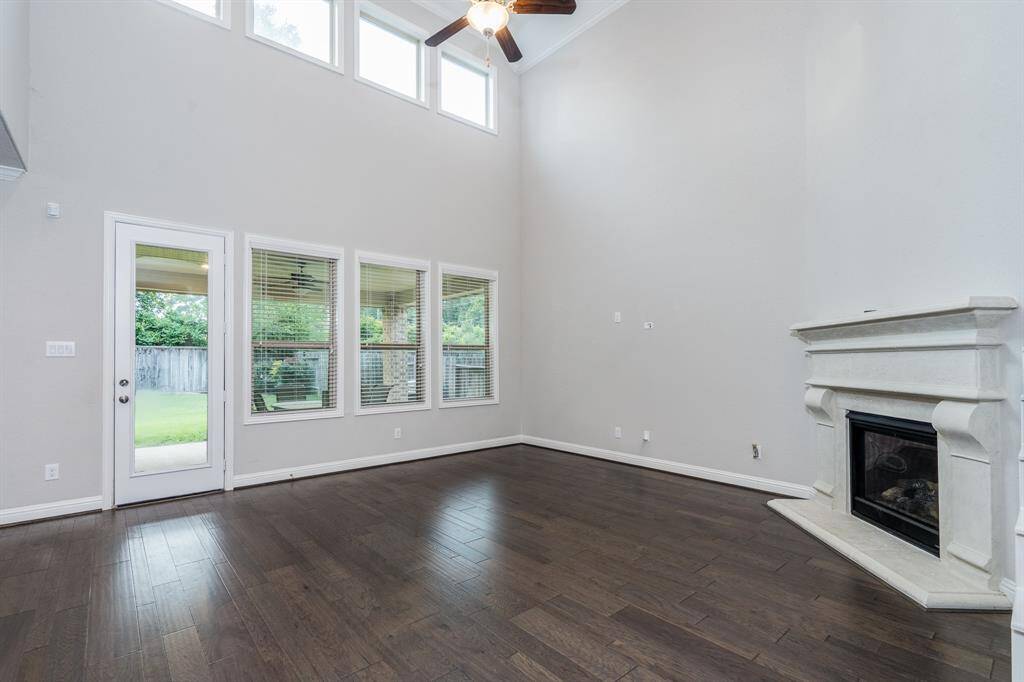 Spacious living room with a soaring high ceiling.