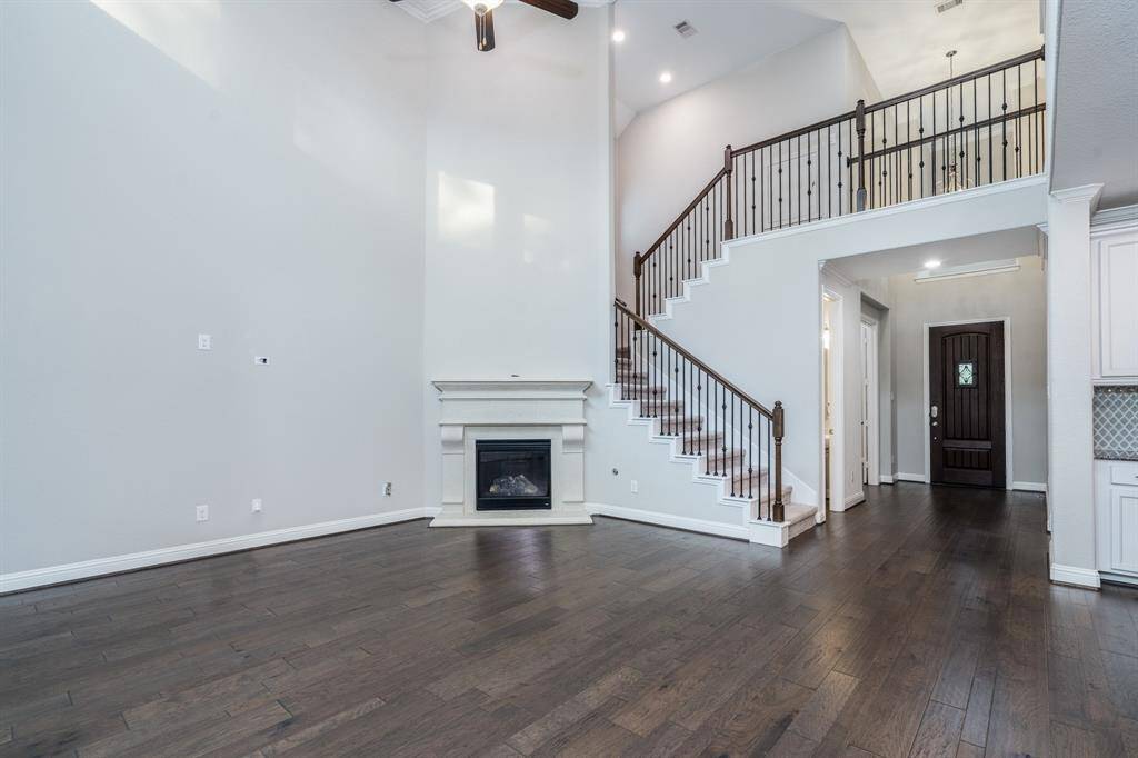 Opposite view shows the attractive wrought iron balusters on the staircase and railing.