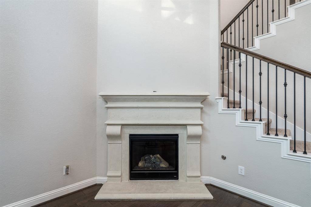 Living is anchored by a cozy fireplace.