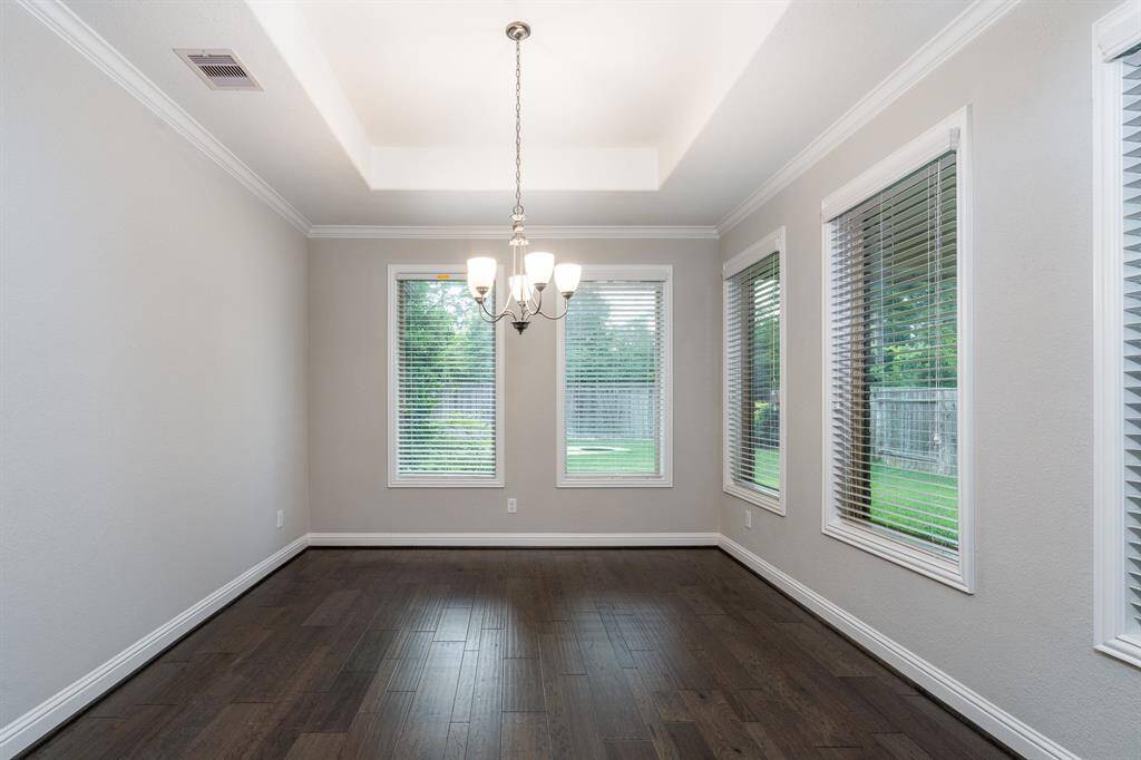 Surrounded by windows with backyard views this is a beautiful place to sit down and enjoy your family.