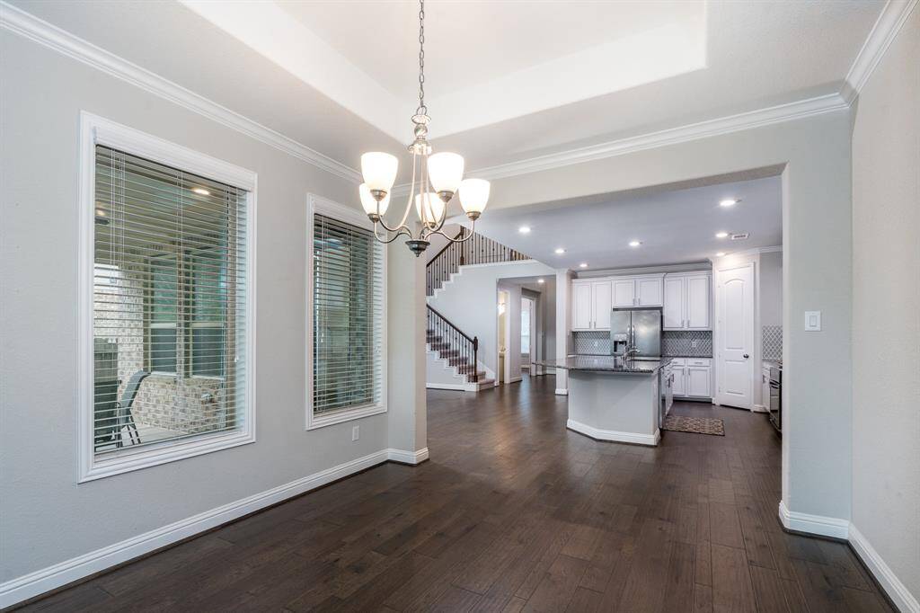 The gleaming wood floors continue throughout these areas.