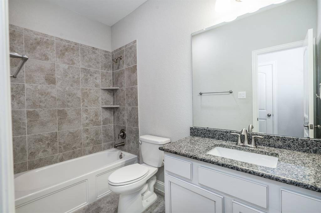 One of the two full baths upstairs both have granite counters.