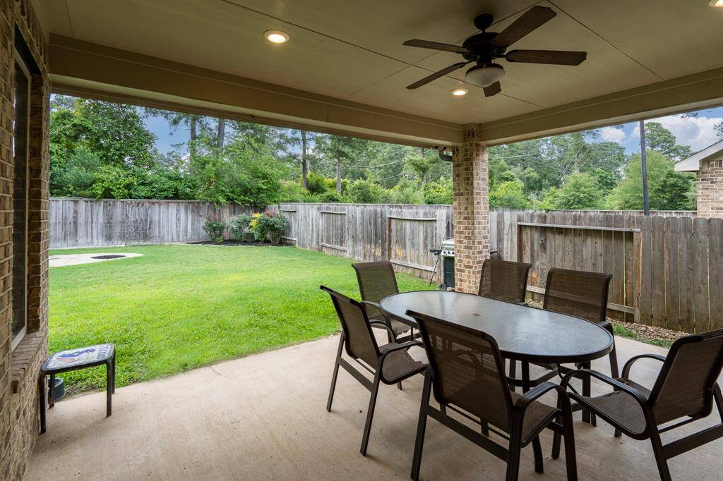 Covered back porch is a generous size for outdoor dining and grilling.