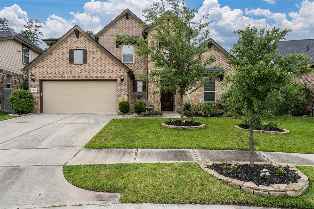 Other features include the garage with room for a fridge, carriage lights and window accents.