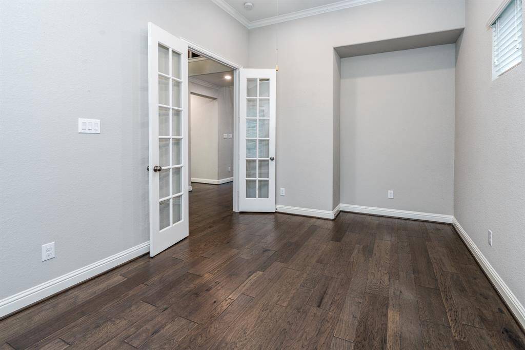 The study is a large space that could accommodate two desks.