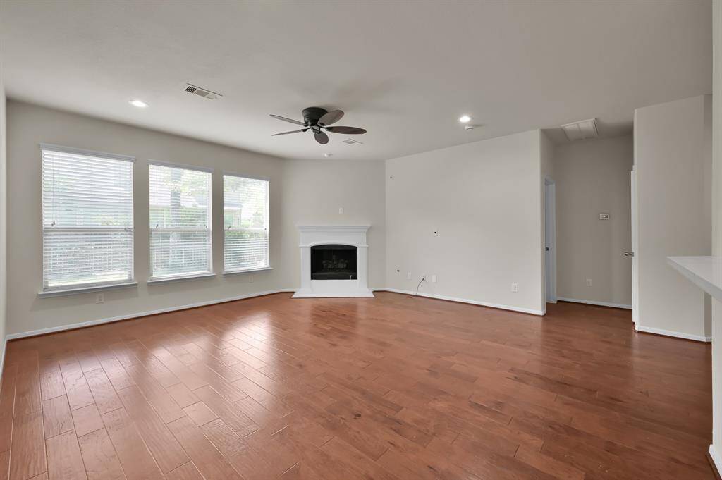 Primary bathroom just updated and upgraded features frameless shower, large tile flooring, quartz countertops, framed mirrors, custom lighting, garden tub and large walk-in closet.