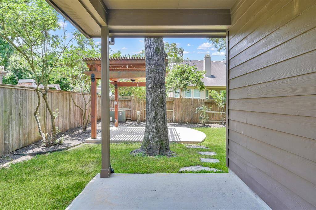 Covered back patio and detached additional covered seating area/pergola.