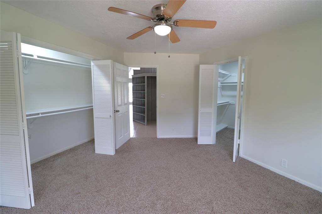 Primary suite with two closets and en-suite bathroom.