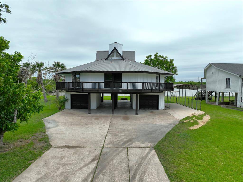 Double wide driveway with Extra parking for boat or RV.