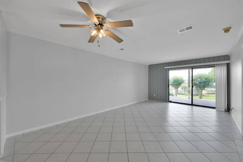 Tile flooring throughout with carpet in the bedrooms.