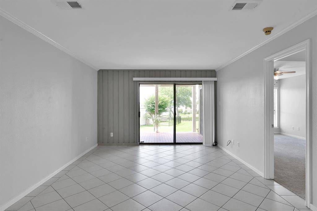 The sliding glass door allows plenty of natural light to brighten the home.