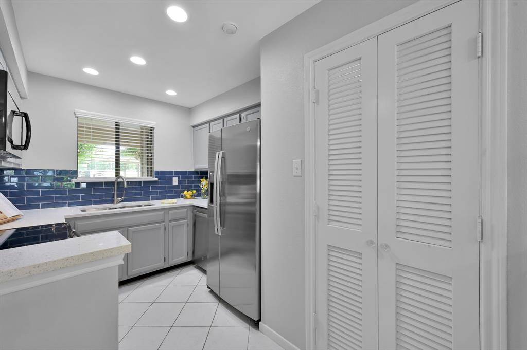 New quartz countertops with subway tile backsplash.