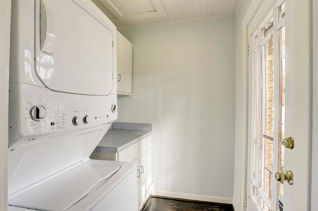 The utility/mud room is conveniently located by the back door and has cabinet and counter space.