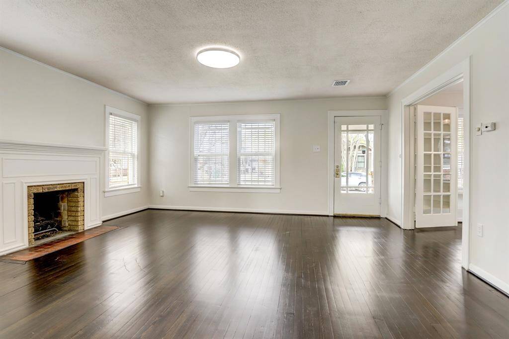 Another view of the living room with the French doors that lead to the bonus room.