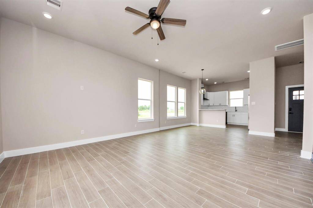 Open living room to dining and kitchen.