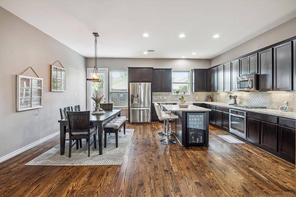 The kitchen boasts a large layout, perfect for a coffee bar and for entertaining.