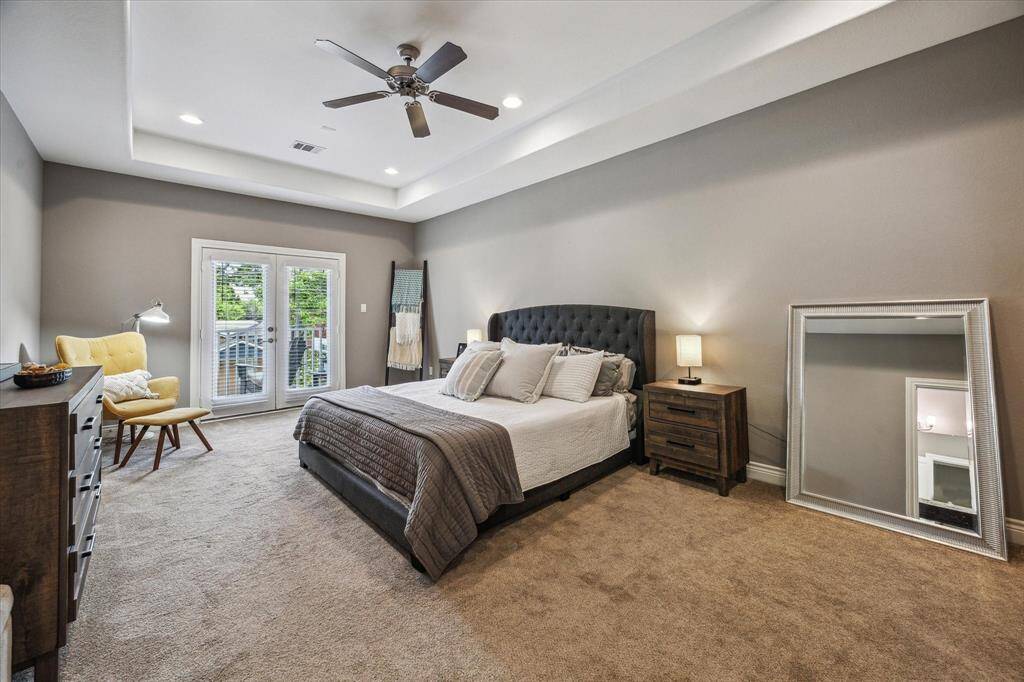 The primary bedroom has a balcony that overlooks the neighborhood and has plenty of space throughout.