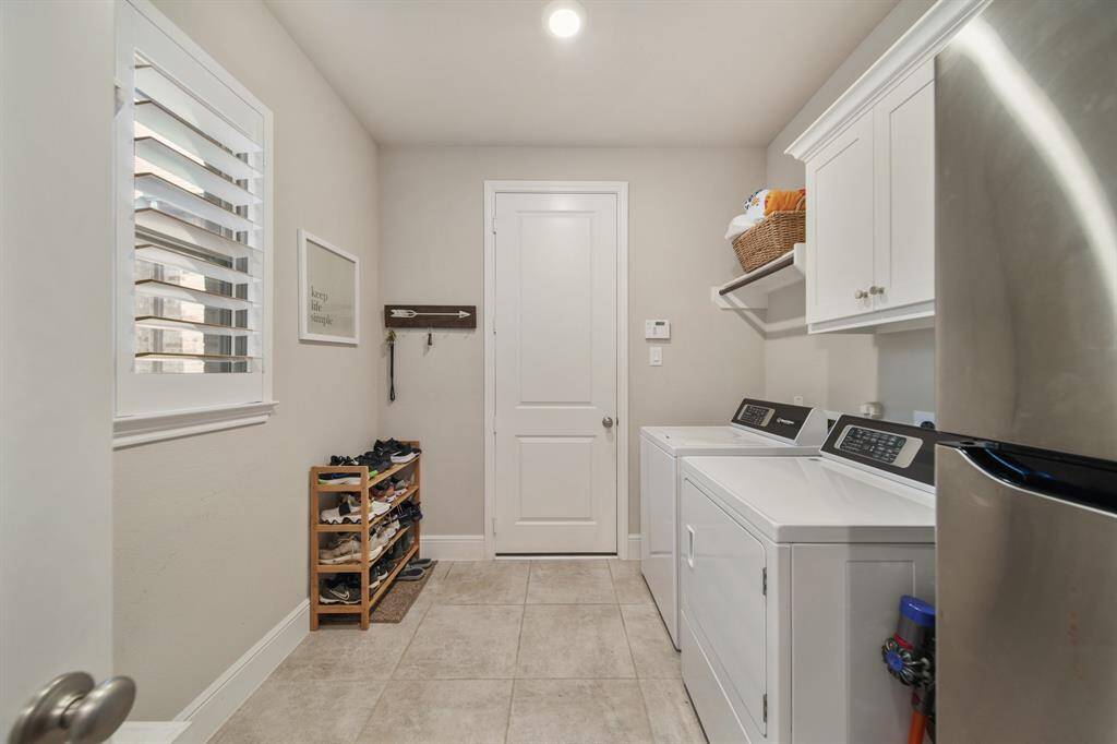 This well-appointed space includes ample storage and efficient organization, making laundry day a breeze while keeping your home tidy and functional.