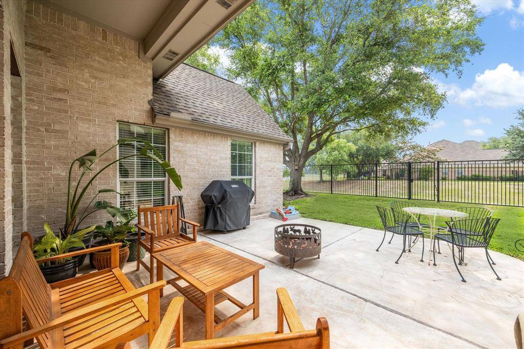 Enjoy the beauty of nature right from your backyard! This outdoor space features a spacious patio for relaxing or entertaining (SHADED & BREEZY in the afternoons!), a lush lawn shaded by mature trees, and backs to a scenic trail and lake (with NO backyard neighbors!), creating a serene backdrop for outdoor gatherings.