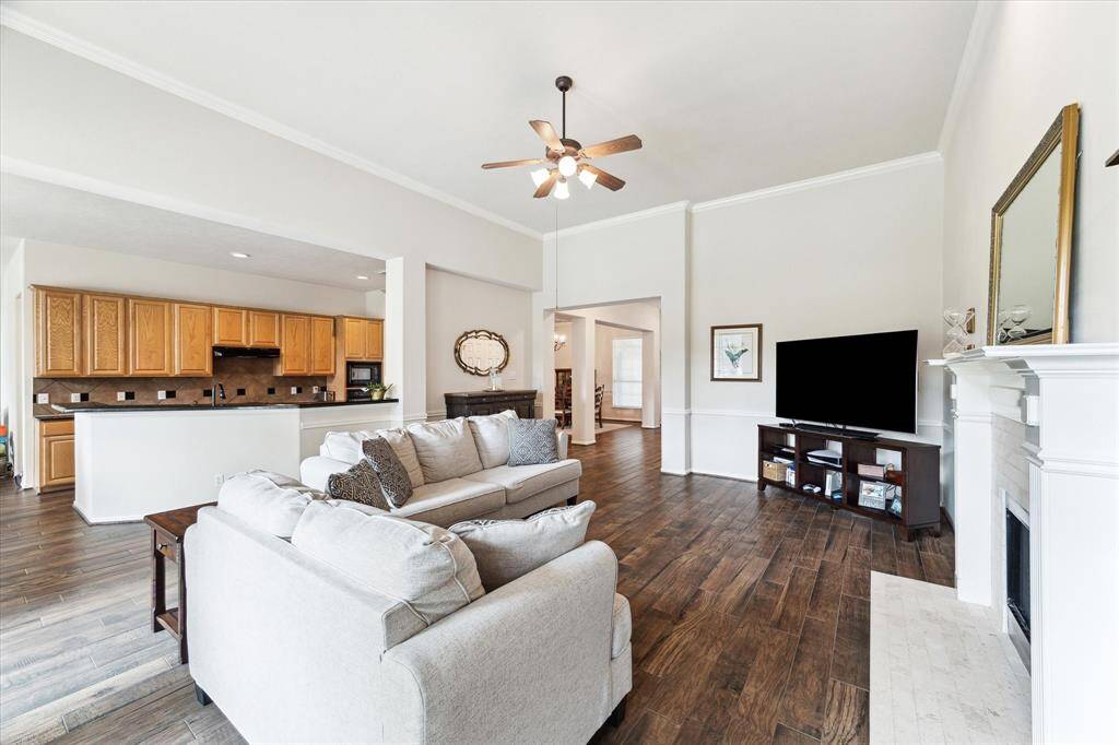 The open-concept layout provides easy connection between the family room, kitchen, and casual dining area. It’s the perfect setting for both entertaining and comfortable everyday living.