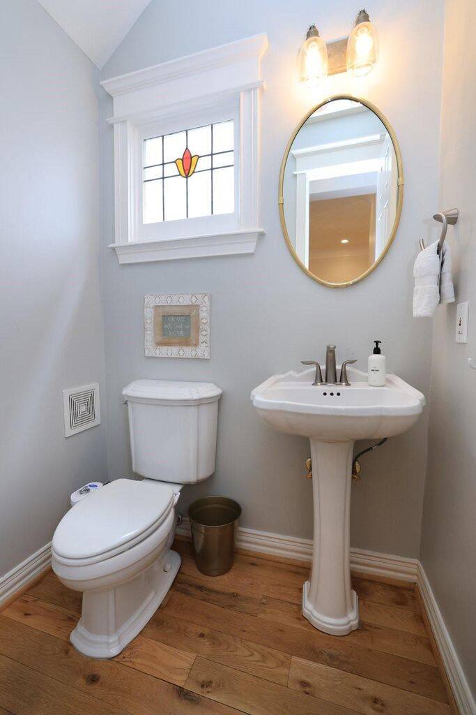 Half bath on the first floor for your guests.  Plus another hidden stained glass window!