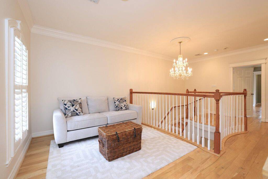 Gameroom or office/study with double doors to the second floor balcony.