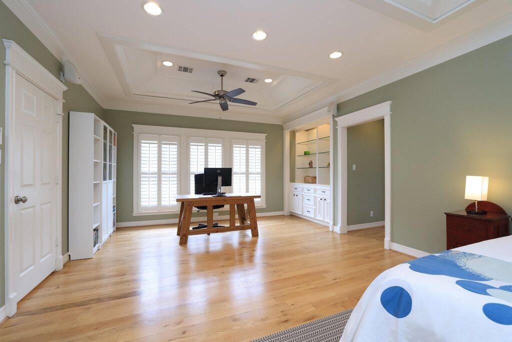Other side of primary suite is being used as an office. Perfect retreat for Reading a book or watching TV late at night.
