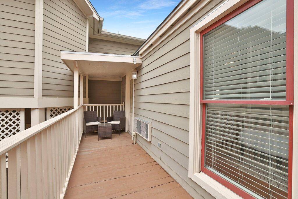 Garage apt has its own balcony.