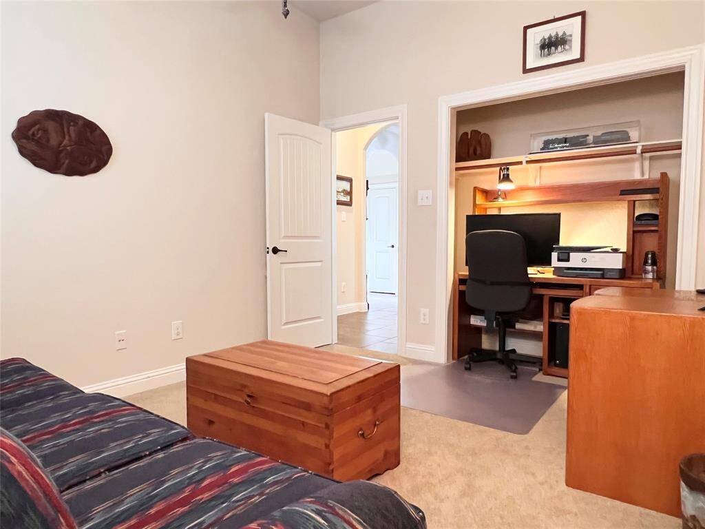 ANOTHER SECONDARY BEDROOM, CURRENTLY BEING USED AS A HOME OFFICE AND TV ROOM.