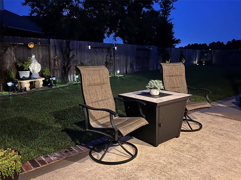 EXTENDED PATIO CREATES SPACE FOR ADDITIONAL SEATING AND SWING.