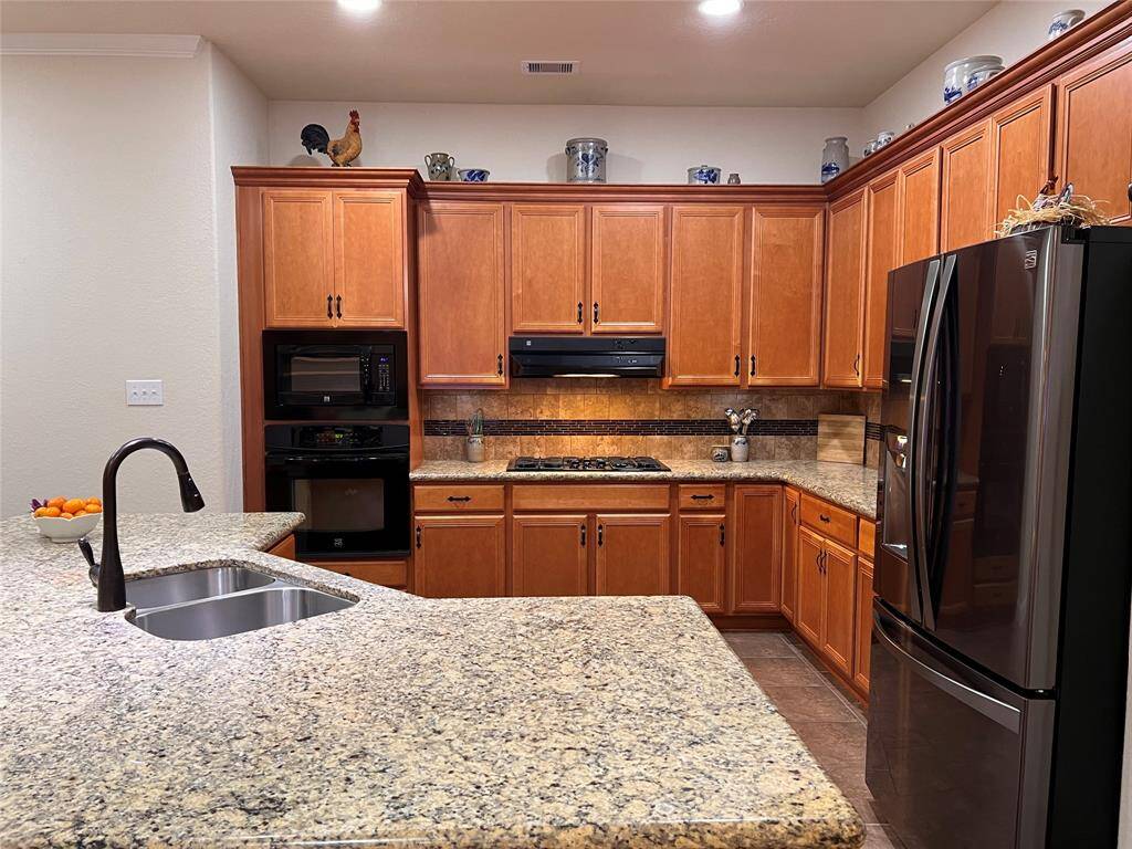 OPEN CONCEPT KITCHEN WITH LARGE ISLAND CHECKS ALL THE BOXES.
