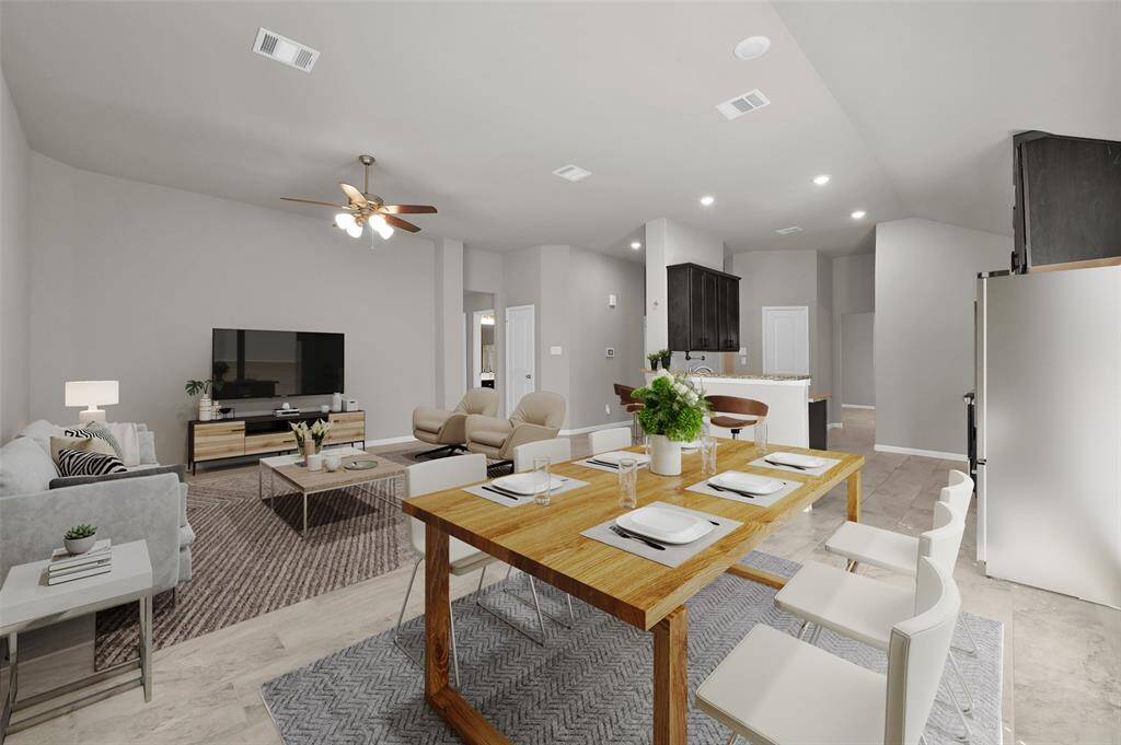 View of breakfast room open to living room (virtually staged)