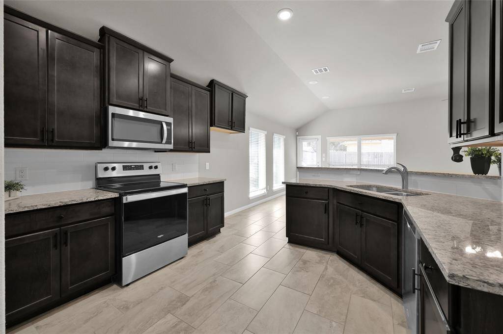 Spacious kitchen with walk in pantry. Upgraded cabinets have internal pull out drawers for easy access to pots/pans and other cooking appliances.