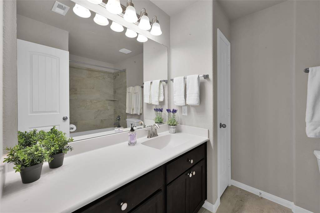 Secondary Bath with tiled shower/tub combo