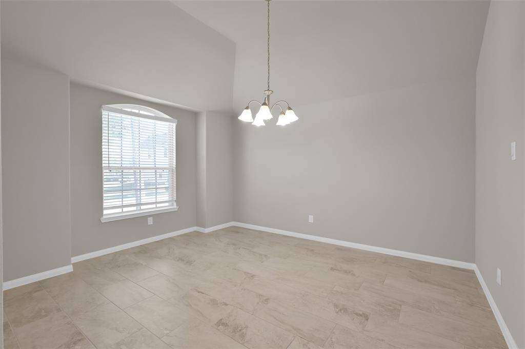 Light and bright Dining Room that can easily be used as a home office.