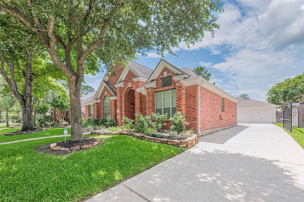 Spacious driveway with automatic gate