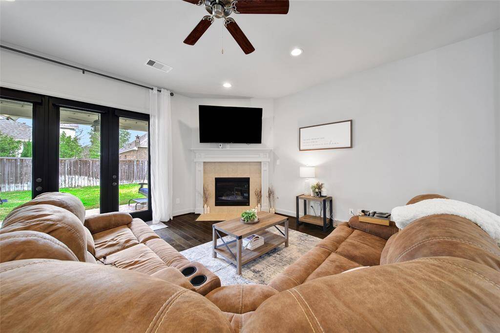 Fireplace tucked into the corner of the living room.