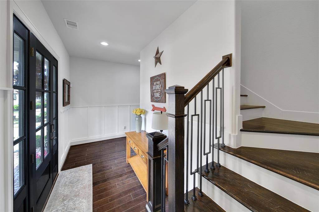 The entry allows the option to go upstairs, or enter the main living area downstairs.
