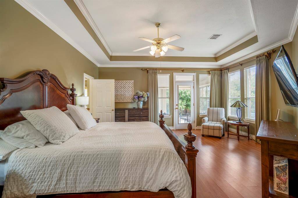 Spacious laundry room offering abundant shelving and cabinet space for organized storage.