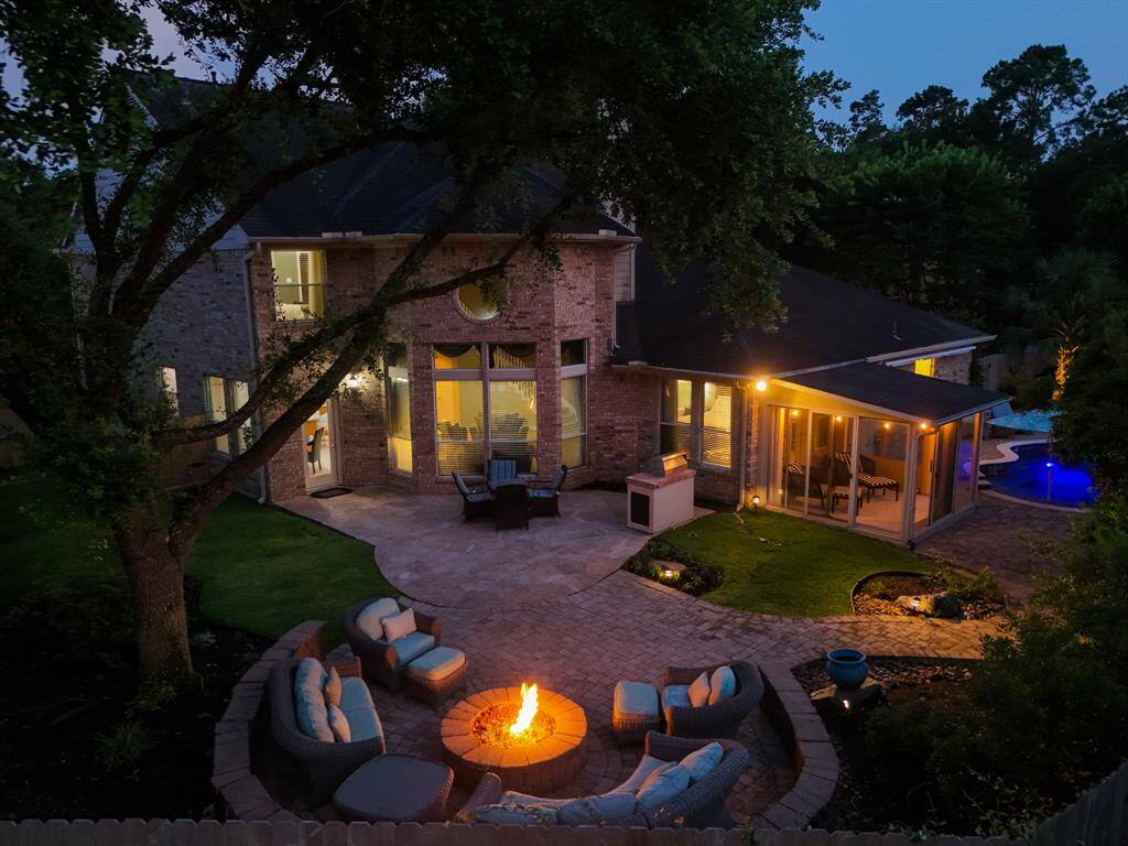 Charming brick home with lush landscaping, a spacious front yard, and great curb appeal.