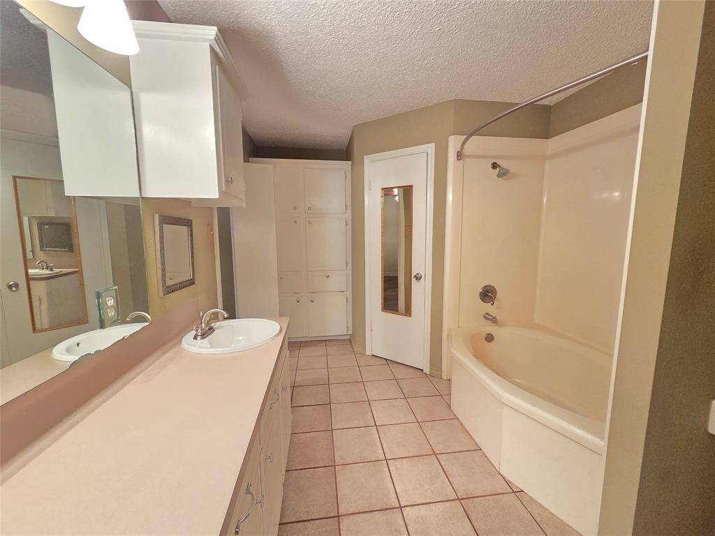 Lots of Cabinet Space in the Primary Bathroom with a Tub/Shower Combo.