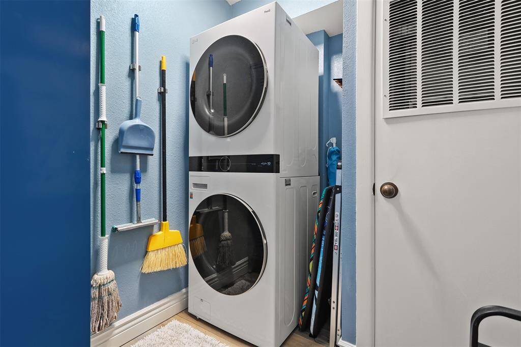Coveted utility room with full size washer and dryer.