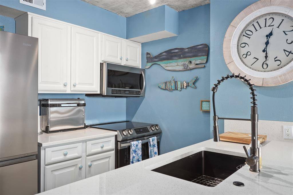 Fully updated kitchen with newer appliances that also stay with the condo.
