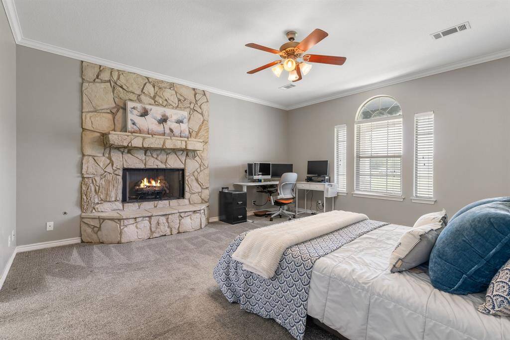 Primary bedroom features it own fireplace.