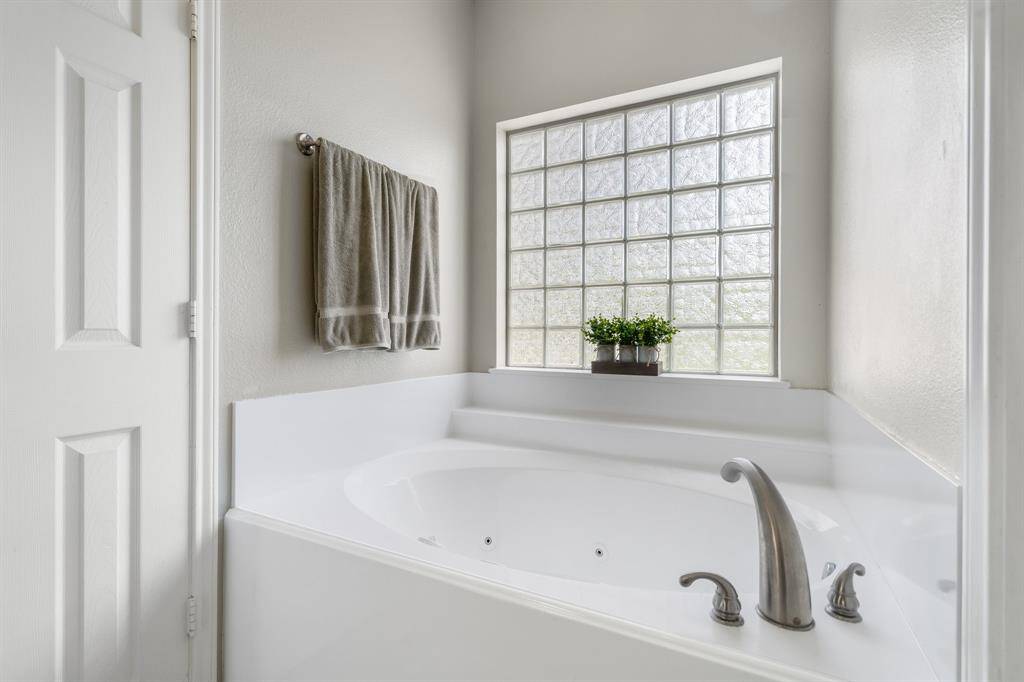 Large soaker tub recently resurfaced.