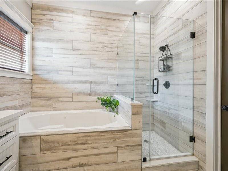 Love the tiled surround for the shower/bath zone.