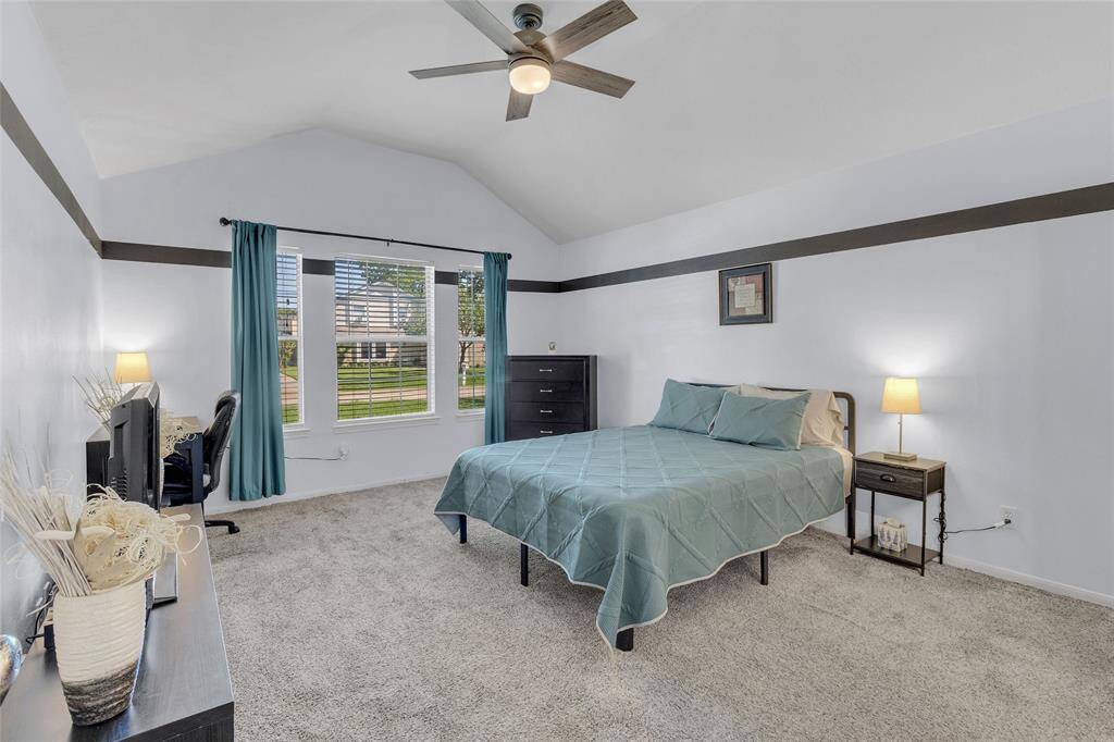 Elegant Master Suite with Vaulted Ceilings and Ample Natural Light