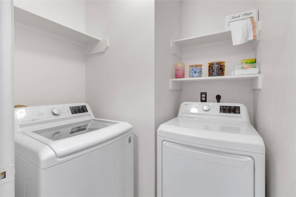 Streamlined Laundry Nook: Equipped with modern appliances and built-in shelving for convenience and organization.