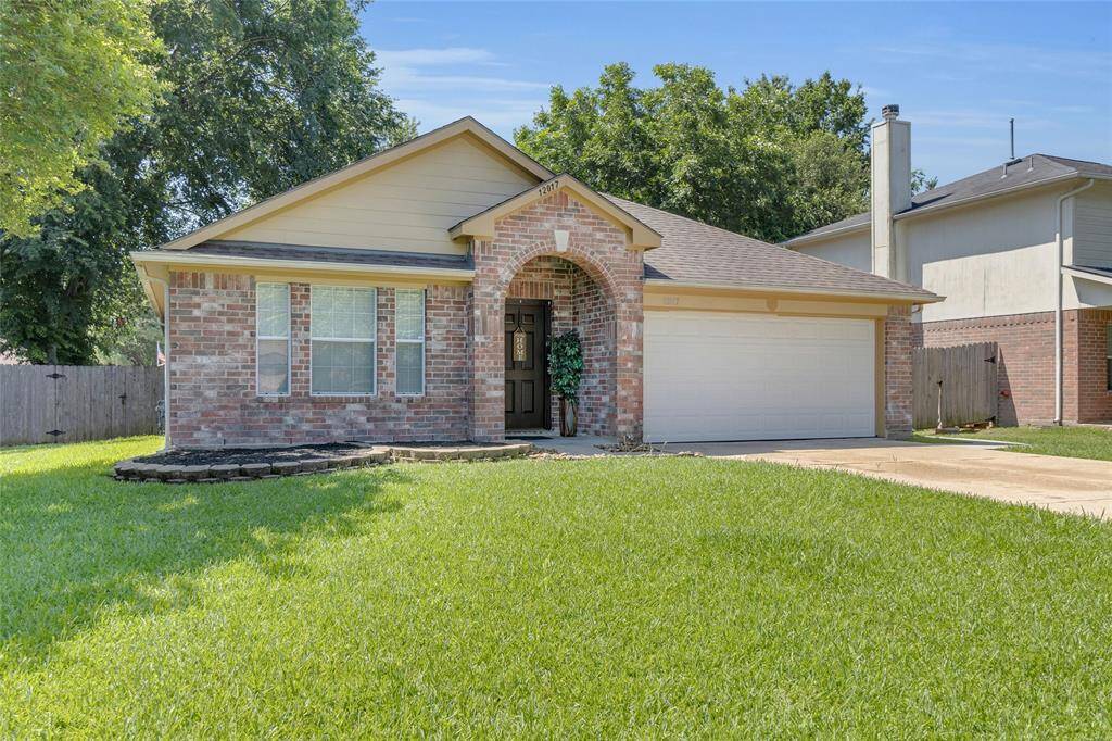 Charming home with a spacious, landscaped yard.